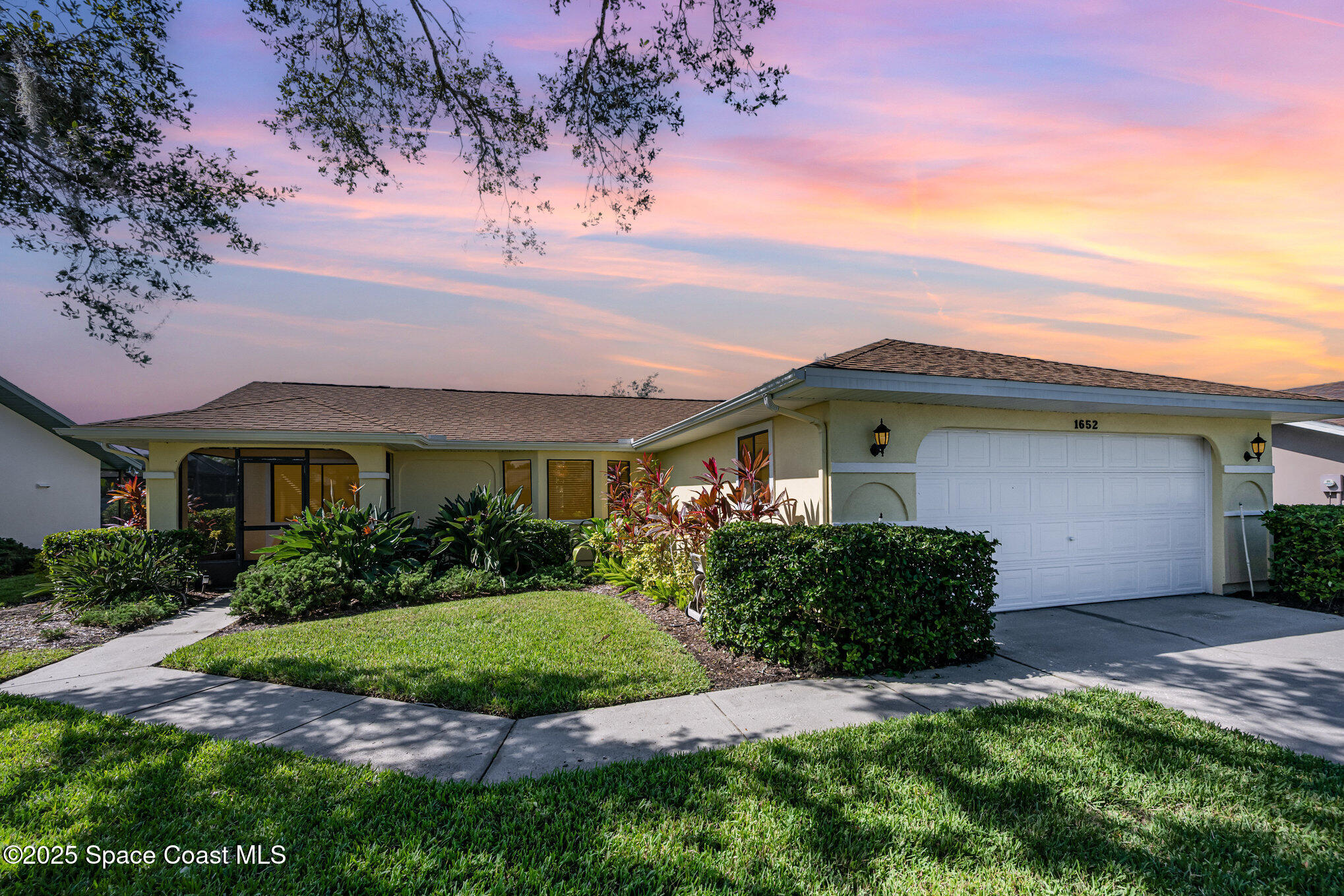 1652 Independence Avenue Melbourne, FL 32940 - Photo 35 of 38 a front view of a house with a garden