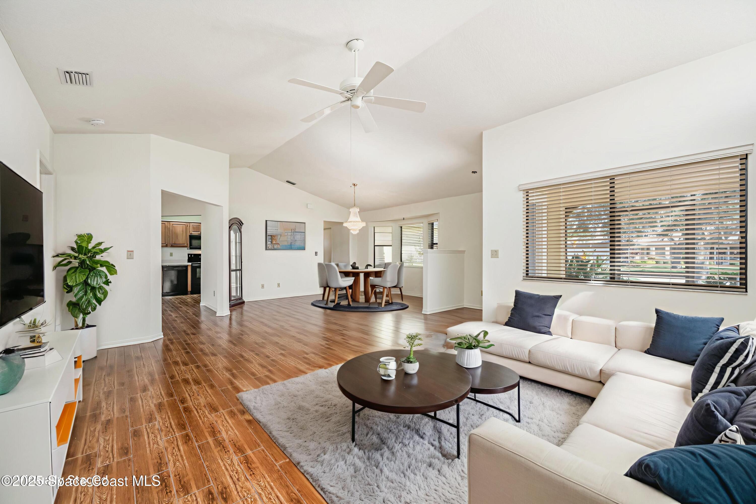 1652 Independence Avenue Melbourne, FL 32940 - Photo 6 of 38 a living room with furniture and a large window