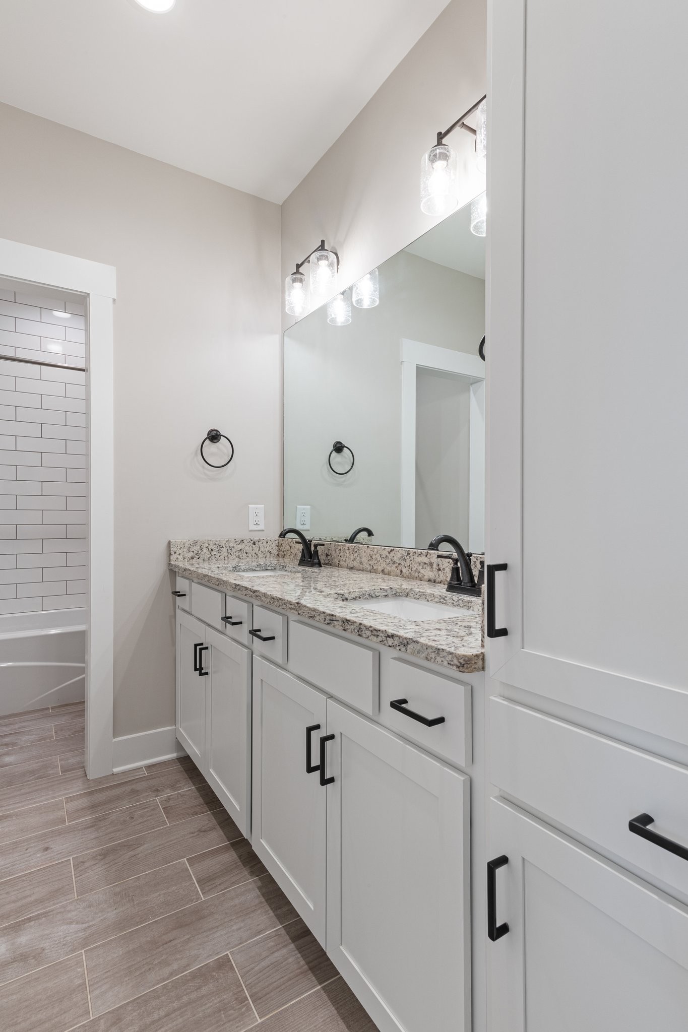 222 Julia Ann Court Springfield, TN 37172 - Photo 10 of 16 a bathroom with a granite countertop sink and a mirror