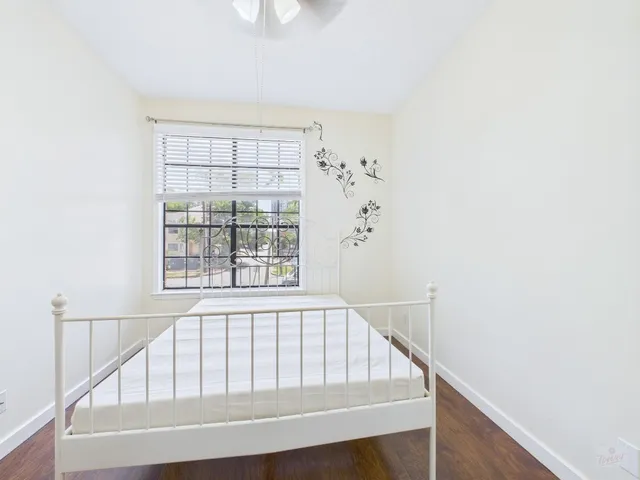 a view of staircase with white walls and a window