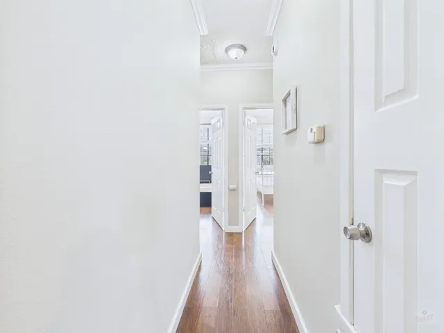 a view of a bathroom with wooden floor