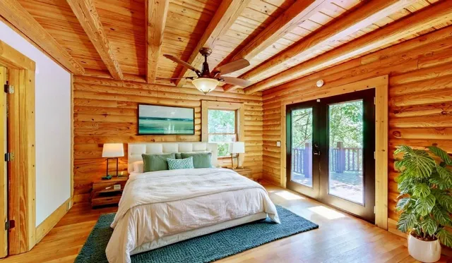 a bathroom with a granite countertop sink and a large mirror