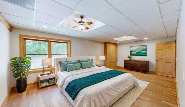 a view of a wooden deck with chairs and a yard