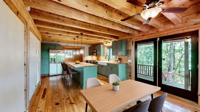 a bathroom with a sink a mirror and a shower