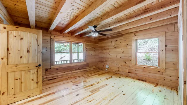 a bathroom with a granite countertop sink mirror vanity and toilet