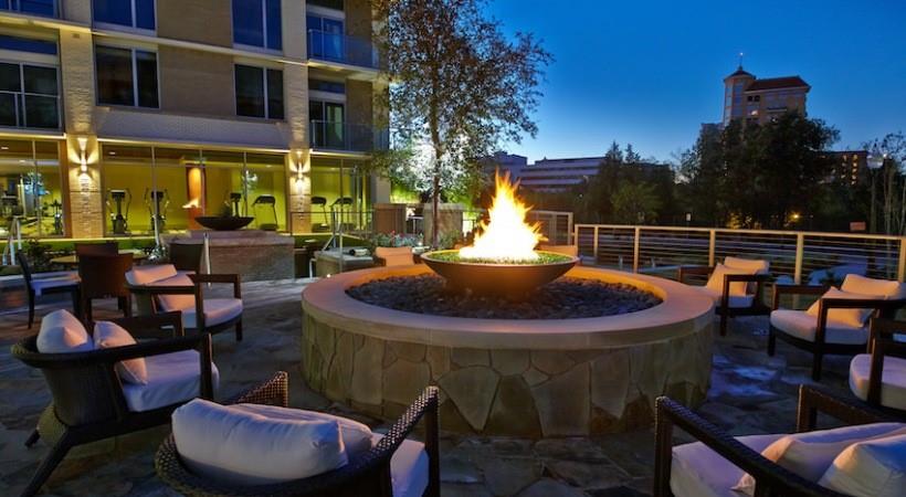 2728 Cedar Springs Road, Unit 1801 Dallas, TX 75201 - Photo 17 of 26 a view of a patio with couches table and chairs and potted plants