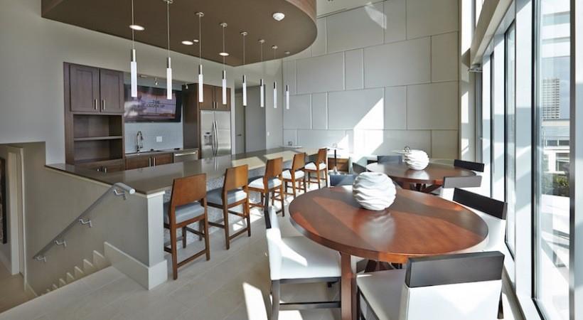 2728 Cedar Springs Road, Unit 1801 Dallas, TX 75201 - Photo 20 of 26 a kitchen with granite countertop kitchen island stainless steel appliances a table and chairs