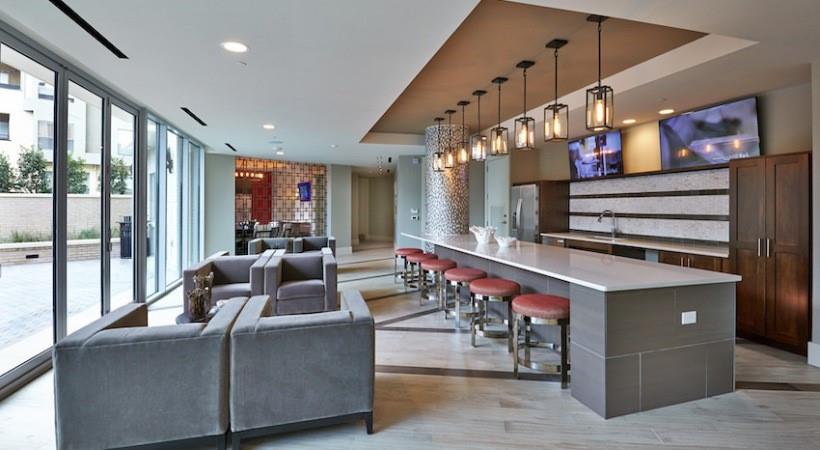 2728 Cedar Springs Road, Unit 1801 Dallas, TX 75201 - Photo 21 of 26 a living room with furniture a flat screen tv and a floor to ceiling window