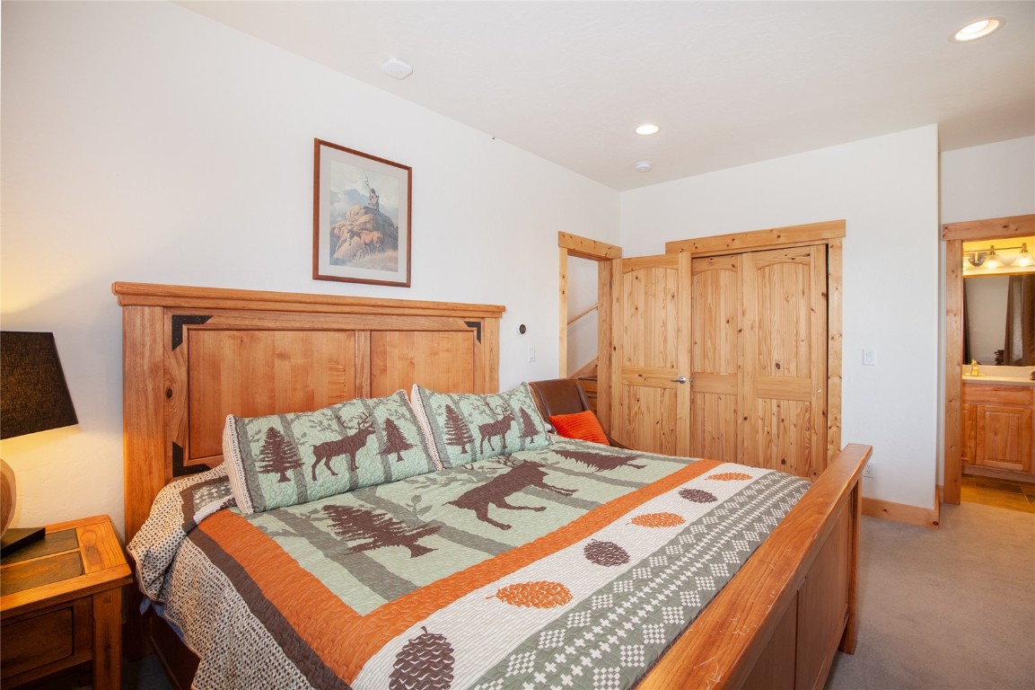 301 Polaris Road Fairplay, CO 80440 - Photo 21 of 35 a bedroom with a bed and wooden floor