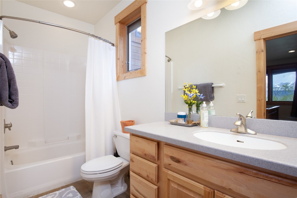 301 Polaris Road Fairplay, CO 80440 - Photo 25 of 35 a bathroom with a granite countertop sink toilet and shower