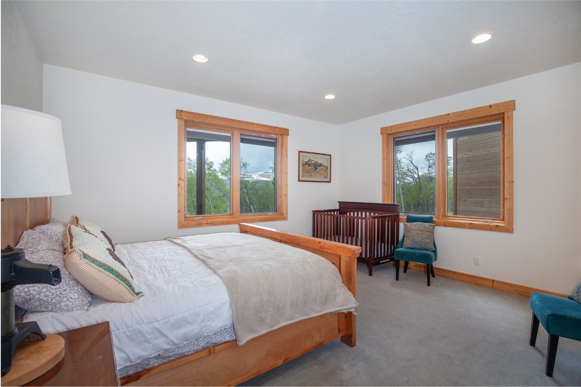 301 Polaris Road Fairplay, CO 80440 - Photo 26 of 35 a bedroom with a bed and a window
