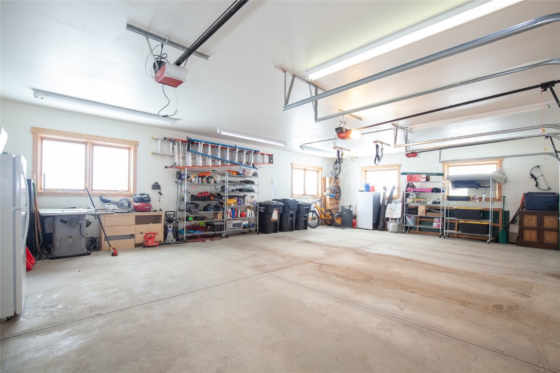 301 Polaris Road Fairplay, CO 80440 - Photo 31 of 35 a view of a garage with cars and a couch