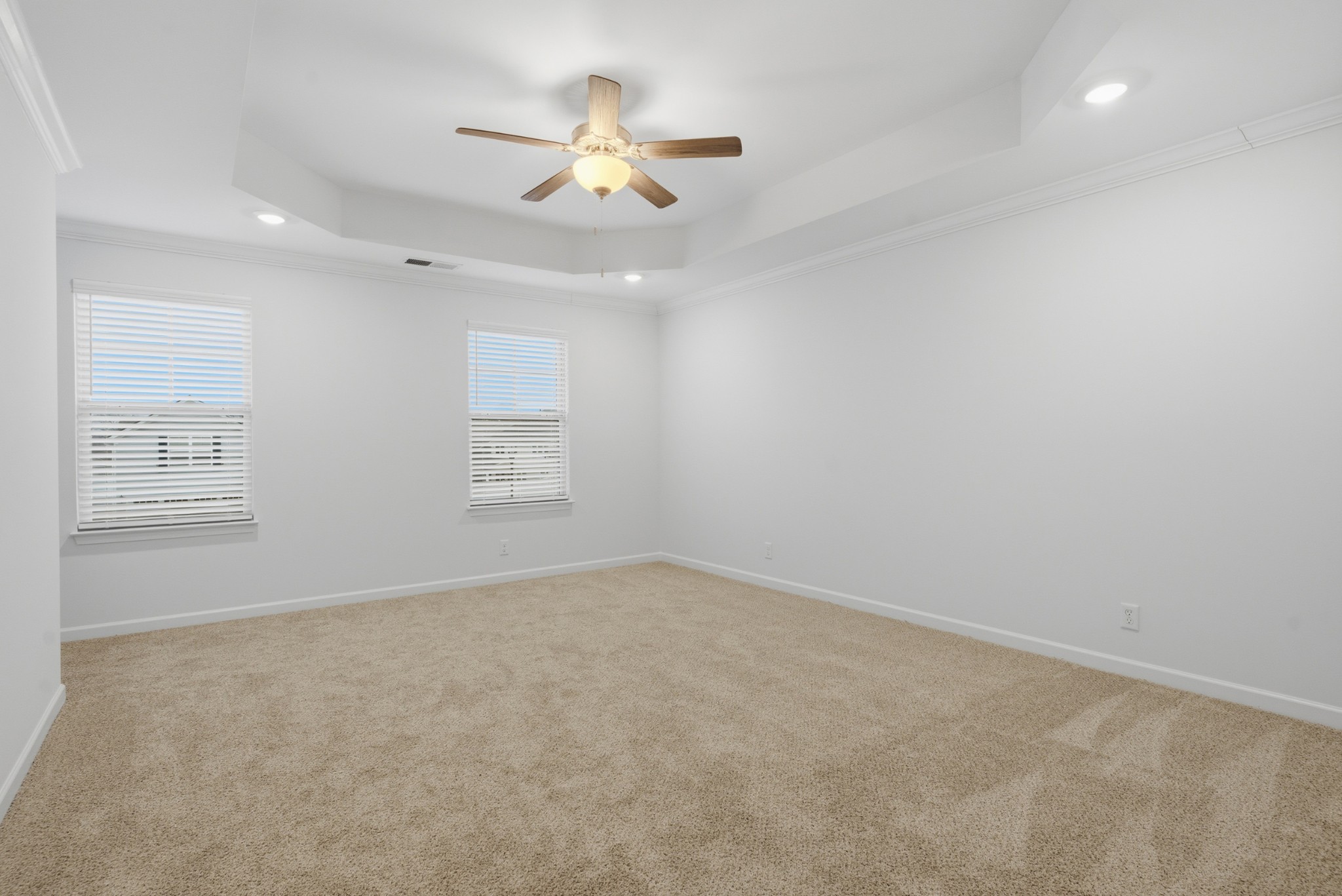4015 Colleton Lane Murfreesboro, TN 37153 - Photo 16 of 34 an empty room with a chandelier fan and windows