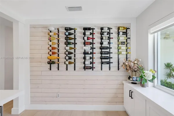 a spacious bedroom with a bed and a flat screen tv