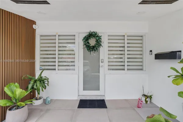 a view of hallway with seating space