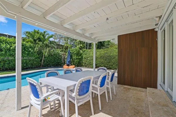 a view of a livingroom with furniture and a potted plant