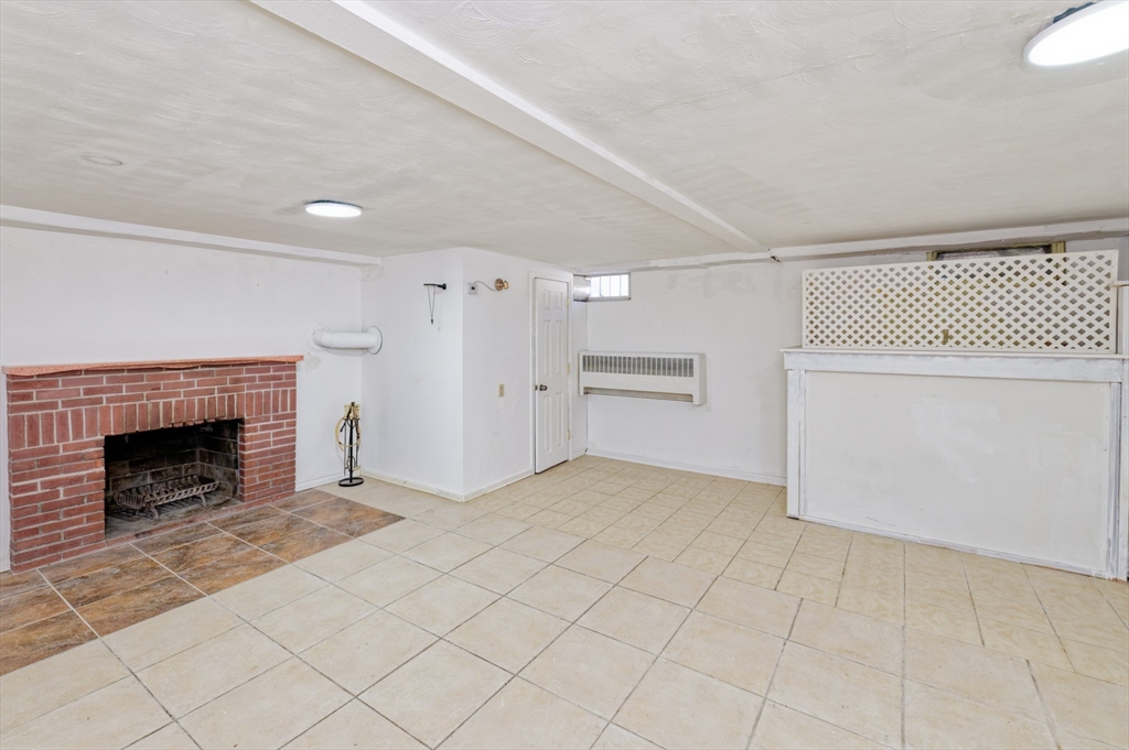 1 Rockland Rd Court Auburn, MA 01501 - Photo 23 of 38 a view of empty room with fireplace and cabinet