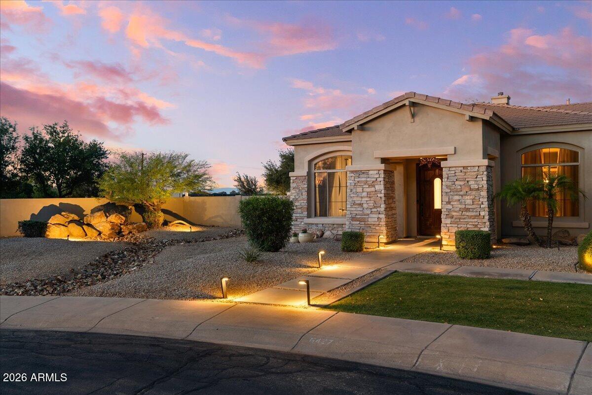 6427 South Magic Court Gilbert, AZ 85298 - Photo 65 of 71 a front view of a house with yard and green space