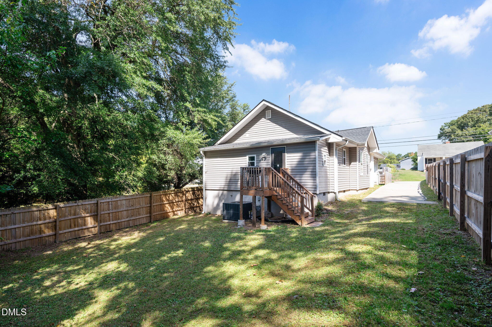 1006 Holloway Street Durham, NC 27701 - Photo 24 of 26 a view of a house with a yard and sitting area