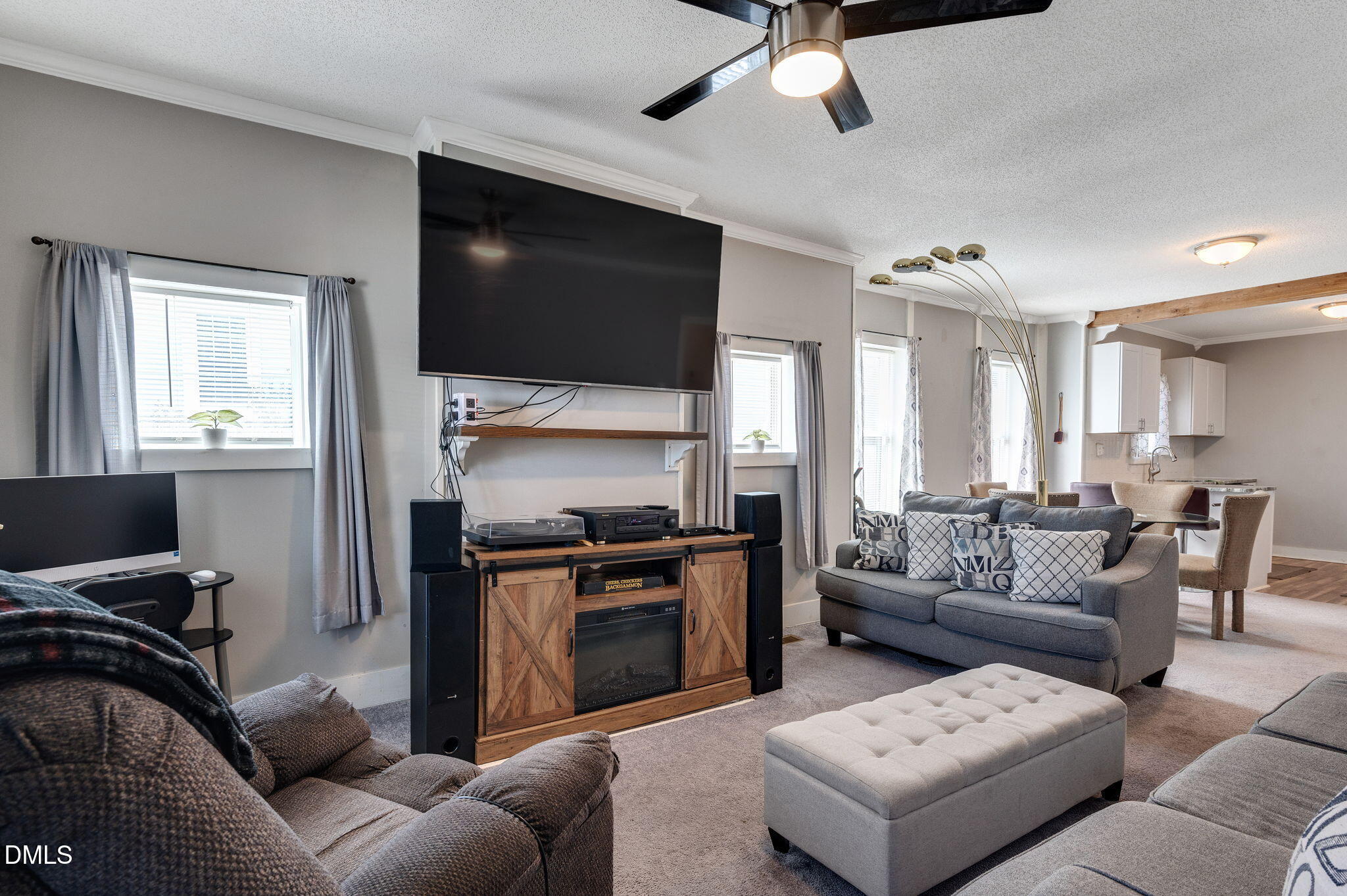 1006 Holloway Street Durham, NC 27701 - Photo 4 of 26 a living room with furniture and a flat screen tv