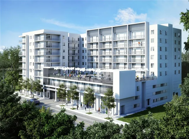 a front view of a building with a garden