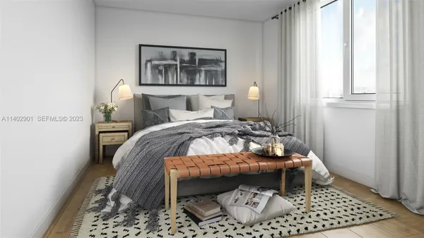 a bedroom with a bed and a dresser