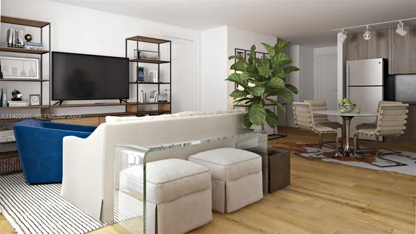 a living room with furniture and a potted plant