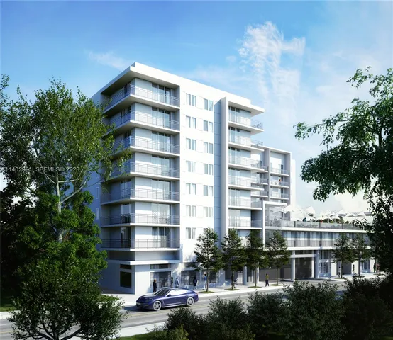 a front view of a building with a garden and plants