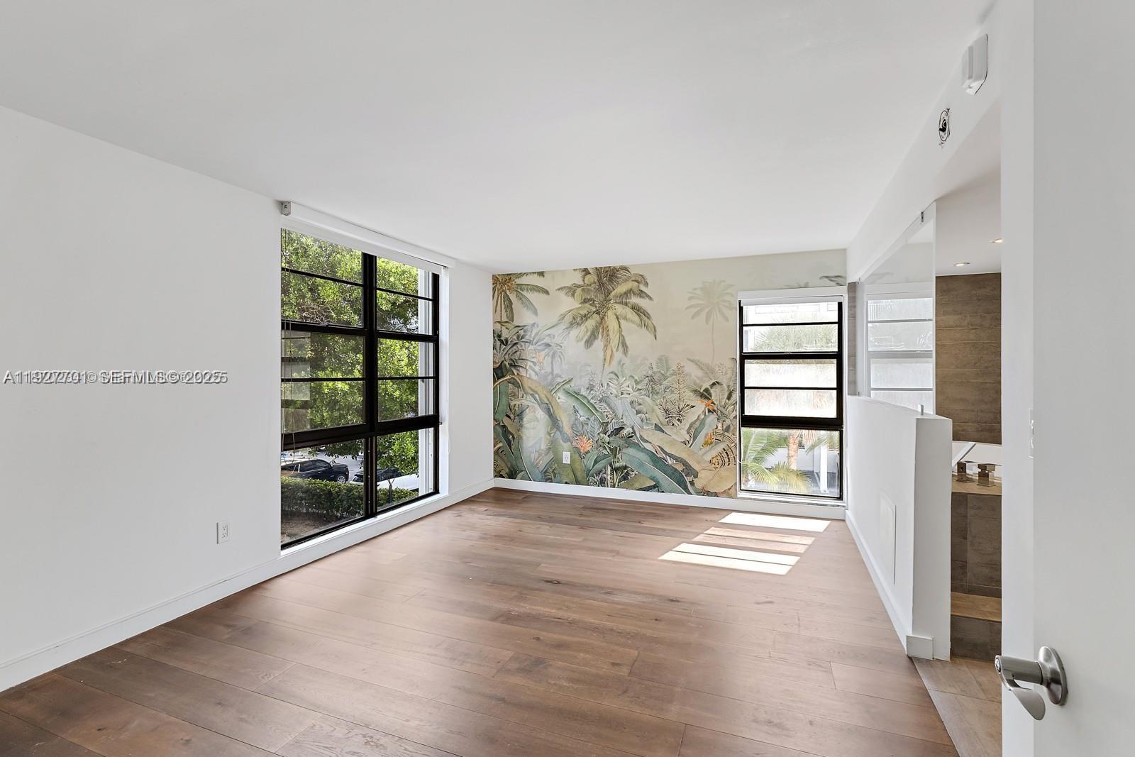 100 Ocean Ln Drive, Unit 304 Key Biscayne, FL 33149 - Photo 13 of 28 wooden floor in an empty room with a window