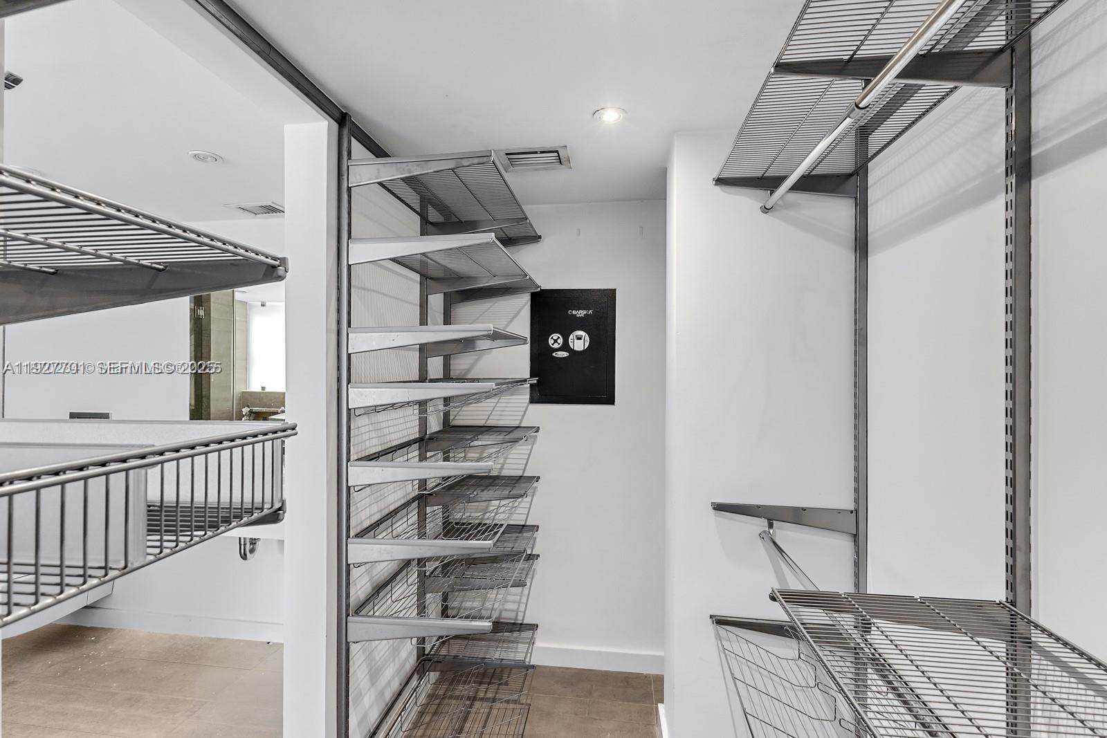 100 Ocean Ln Drive, Unit 304 Key Biscayne, FL 33149 - Photo 18 of 28 a view of a walk in closet