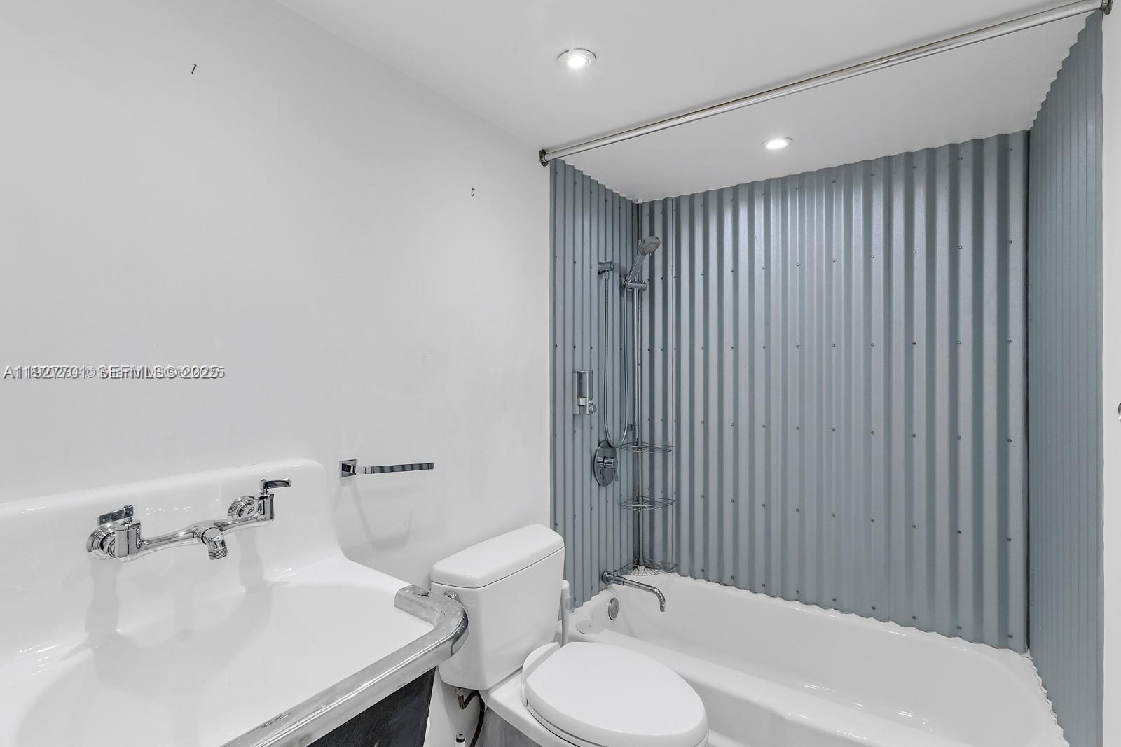 100 Ocean Ln Drive, Unit 304 Key Biscayne, FL 33149 - Photo 21 of 28 a bathroom with a sink toilet and shower