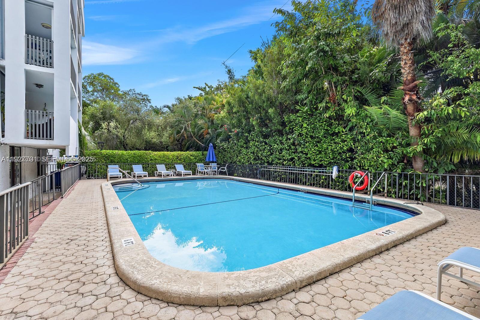100 Ocean Ln Drive, Unit 304 Key Biscayne, FL 33149 - Photo 26 of 28 a view of swimming pool with seating space