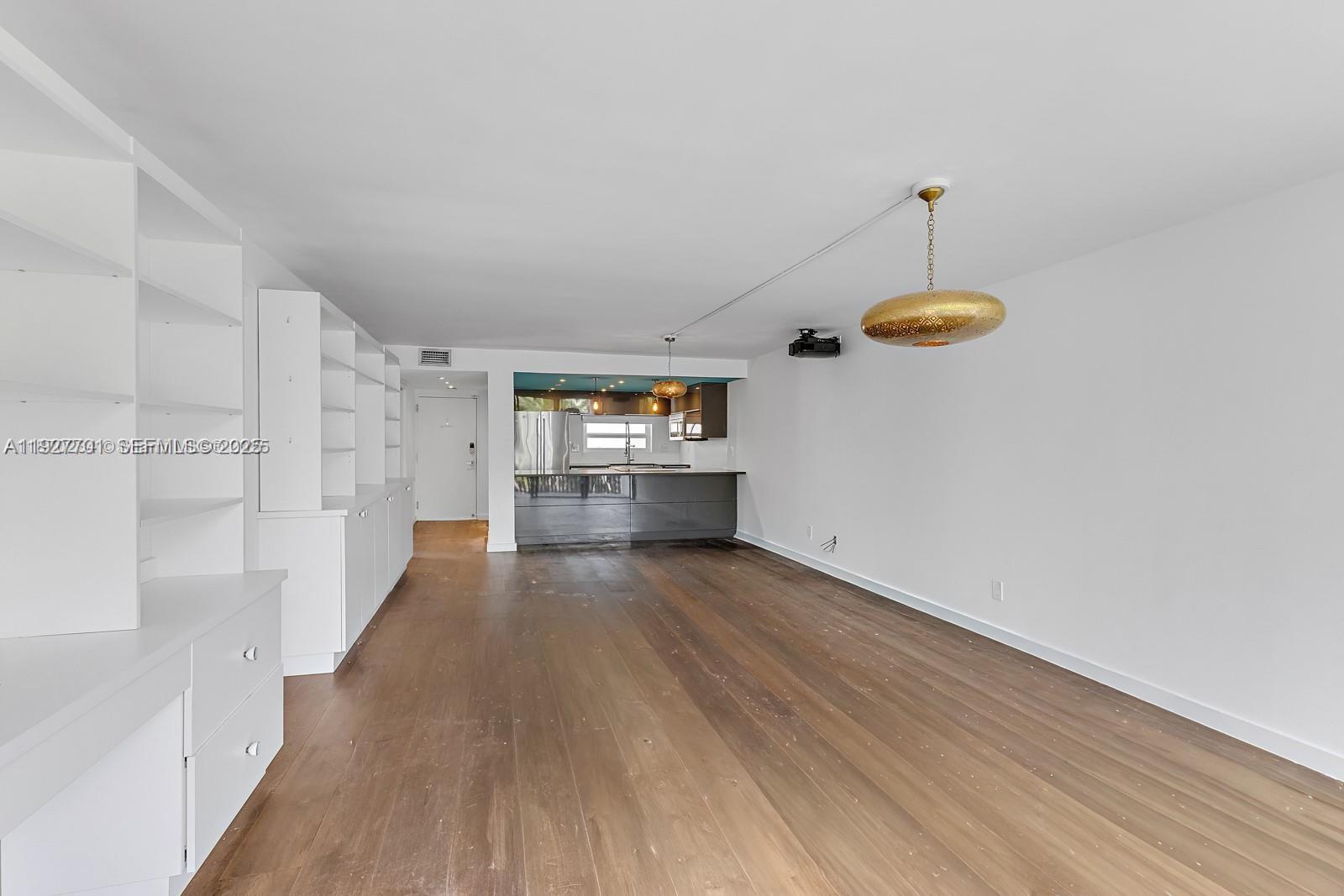 100 Ocean Ln Drive, Unit 304 Key Biscayne, FL 33149 - Photo 8 of 28 a view of a room with wooden floor