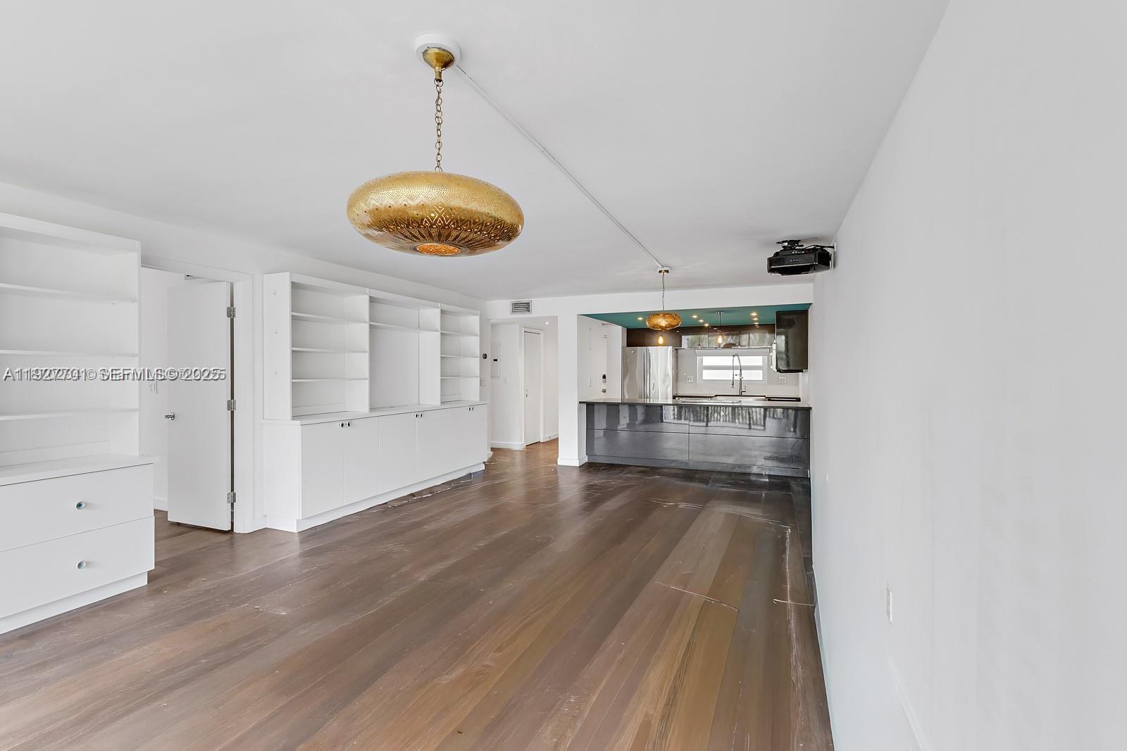 100 Ocean Ln Drive, Unit 304 Key Biscayne, FL 33149 - Photo 9 of 28 a view of a room with wooden floor and windows