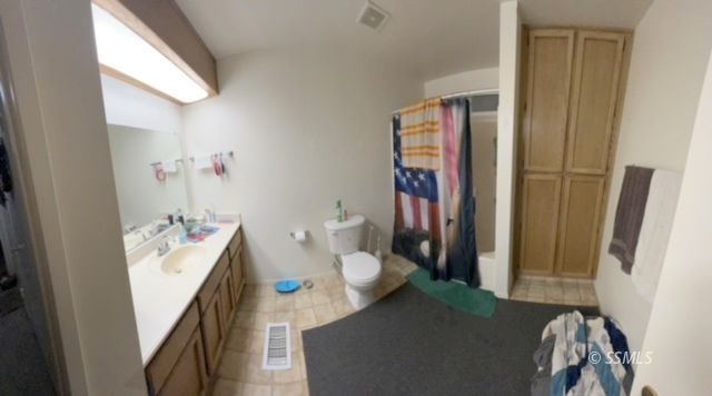 105 South Lilac Street Ridgecrest, CA 93555 - Photo 10 of 11 a bathroom with a sink toilet and shower