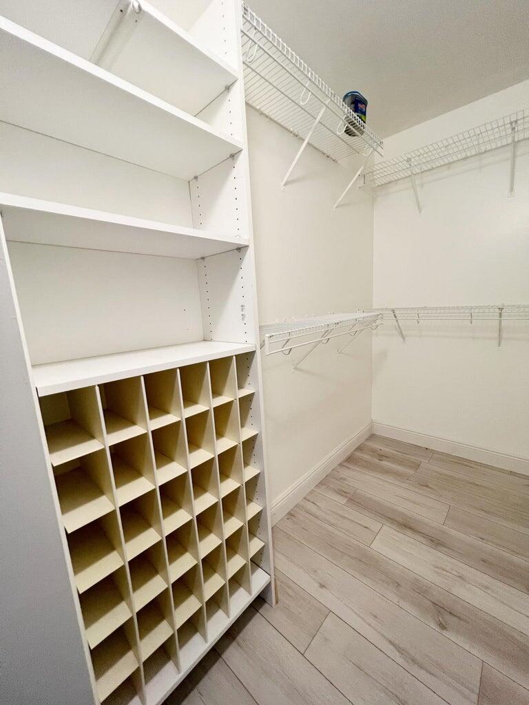 1006 Green Pine Boulevard, Unit A1 West Palm Beach, FL 33409 - Photo 18 of 25 a view of an empty walk in closet