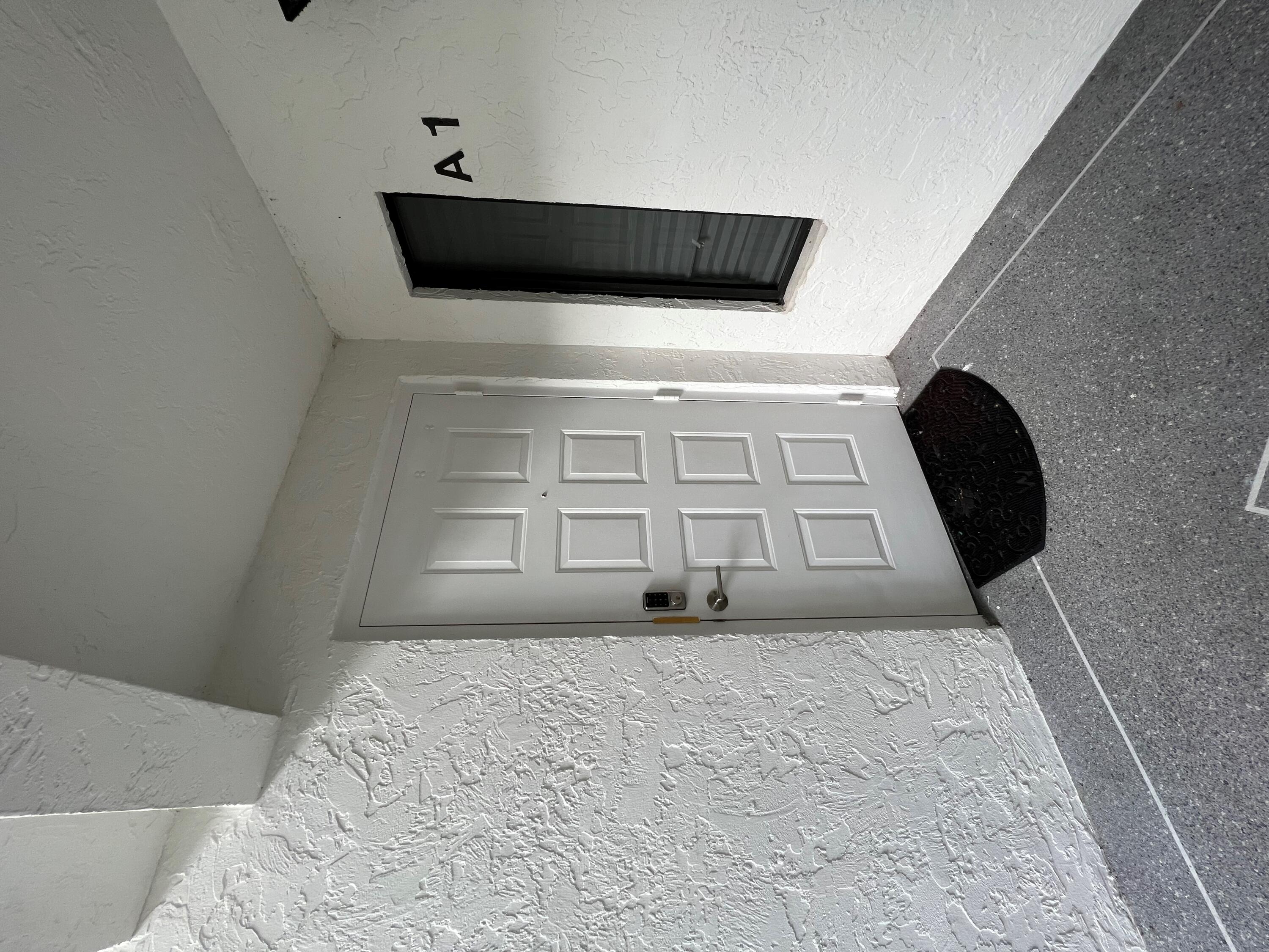 1006 Green Pine Boulevard, Unit A1 West Palm Beach, FL 33409 - Photo 2 of 25 a view of a closet area with rug