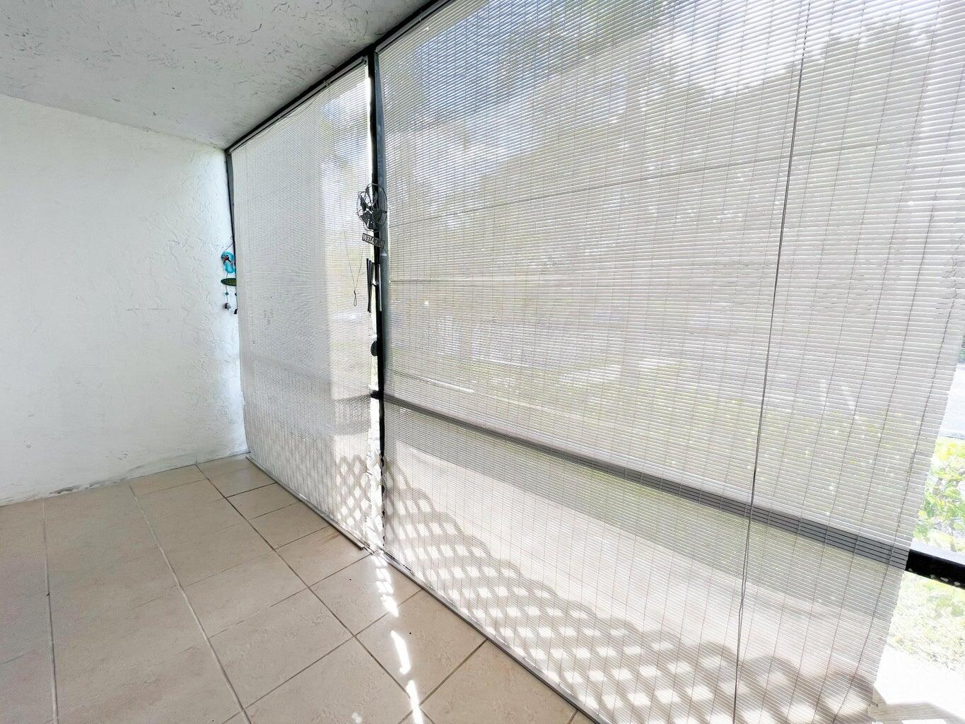 1006 Green Pine Boulevard, Unit A1 West Palm Beach, FL 33409 - Photo 24 of 25 a bathroom with a bathtub and shower