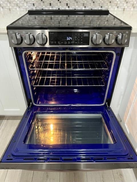 1006 Green Pine Boulevard, Unit A1 West Palm Beach, FL 33409 - Photo 3 of 25 a close view of stove top oven