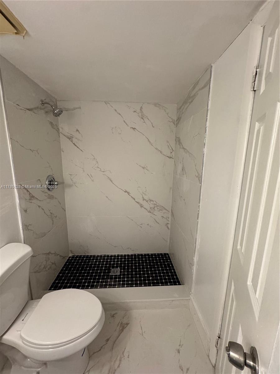10353 North Kendall Drive, Unit BB2 Miami, FL 33176 - Photo 14 of 20 a bathroom with a toilet and a shower