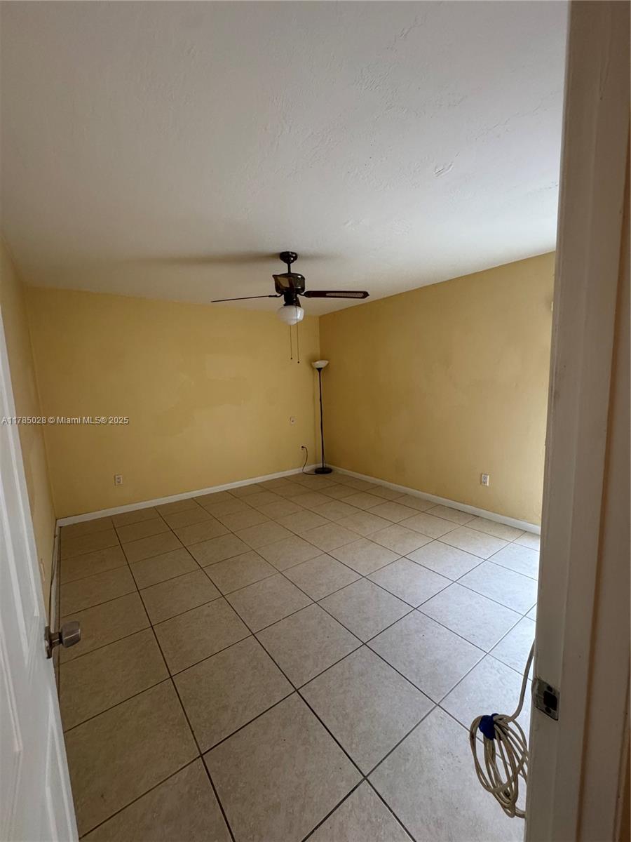 10353 North Kendall Drive, Unit BB2 Miami, FL 33176 - Photo 16 of 20 a view of a room with rack on the wall