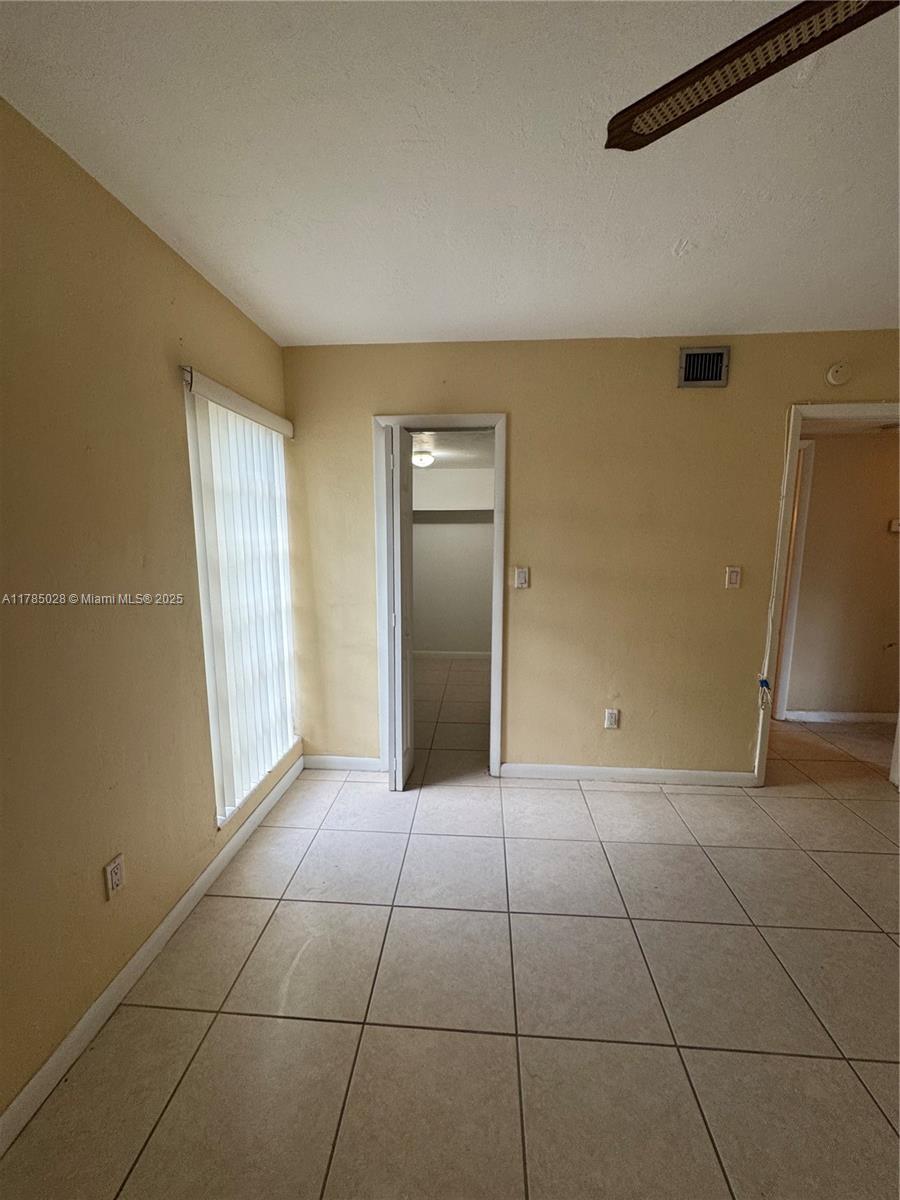 10353 North Kendall Drive, Unit BB2 Miami, FL 33176 - Photo 18 of 20 a view of a livingroom with an empty space and a window