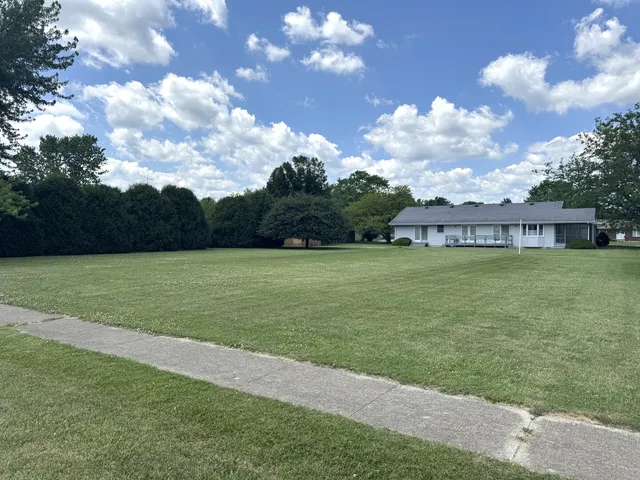 a view of a house with a big yard