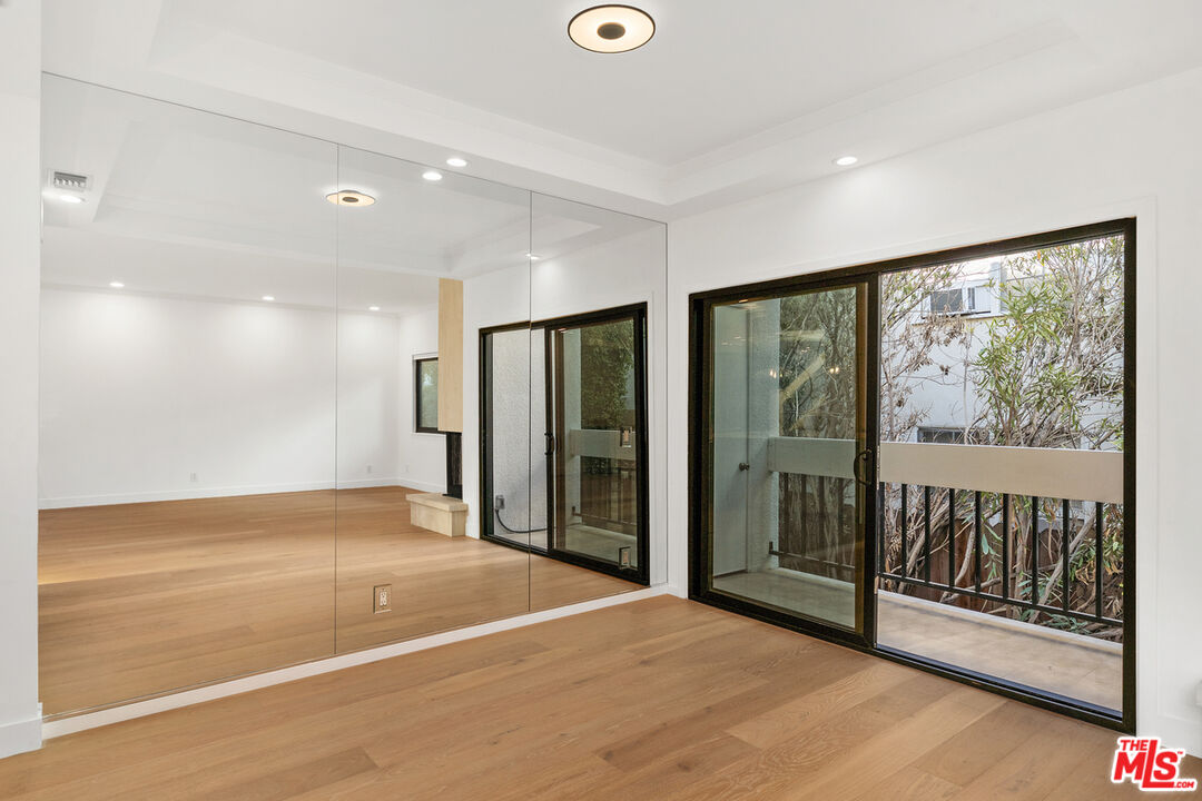234 South Tower Drive, Unit 2 Beverly Hills, CA 90211 - Photo 13 of 54 a view of an empty room with glass door