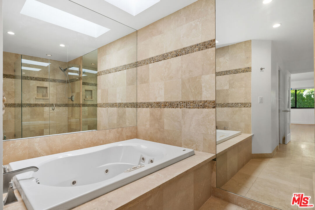 234 South Tower Drive, Unit 2 Beverly Hills, CA 90211 - Photo 43 of 54 a bathroom with a tub a sink and a shower