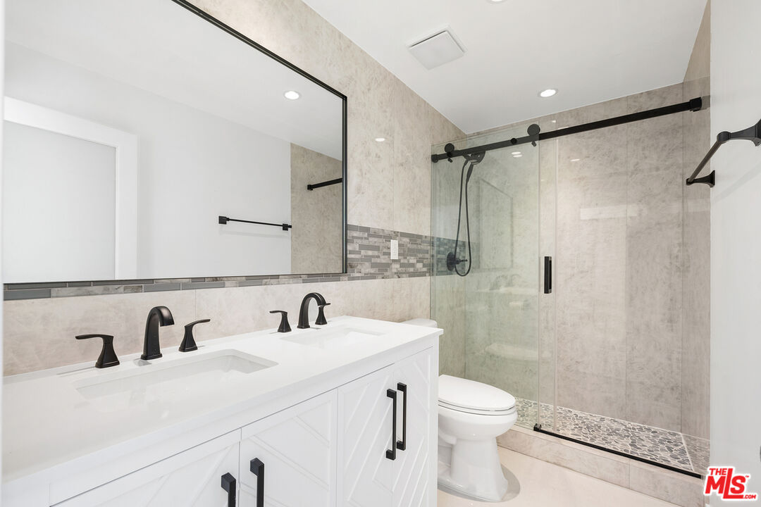 234 South Tower Drive, Unit 2 Beverly Hills, CA 90211 - Photo 47 of 54 a bathroom with a sink toilet and shower