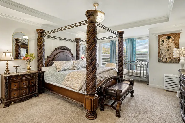 a bedroom with a bed and ceiling fan