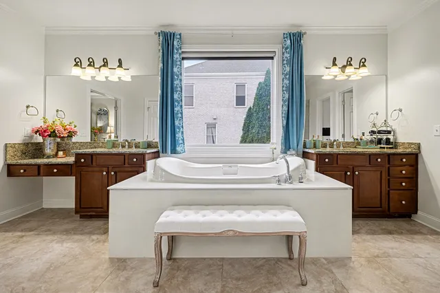 a living room with furniture and a wall painting