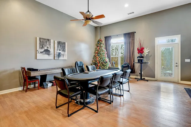 a view of a livingroom with furniture and a flat screen tv