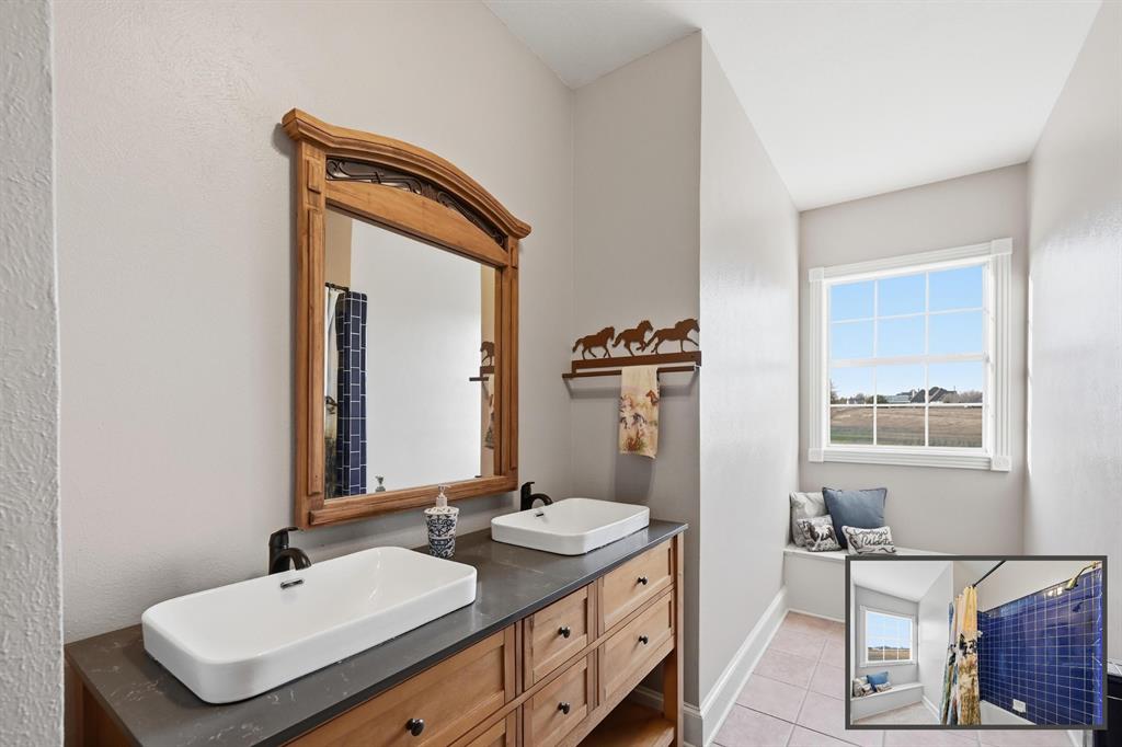 707 Cullins Road Rockwall, TX 75032 - Photo 31 of 40 a bathroom with a sink and a mirror